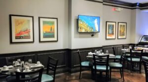 Custom Framed Chicago vintage artwork installed in a restaurant in Evanston