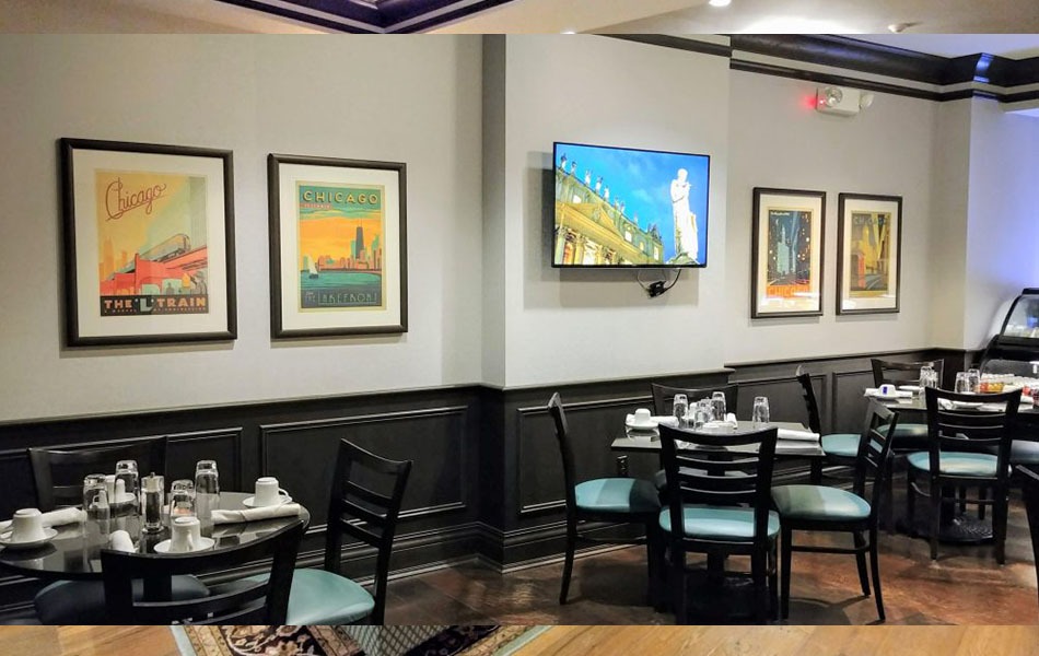 Custom Framed Chicago vintage artwork installed in a restaurant in Evanston