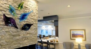 Colorful art sculptures installed on the wall in the healthcare facility