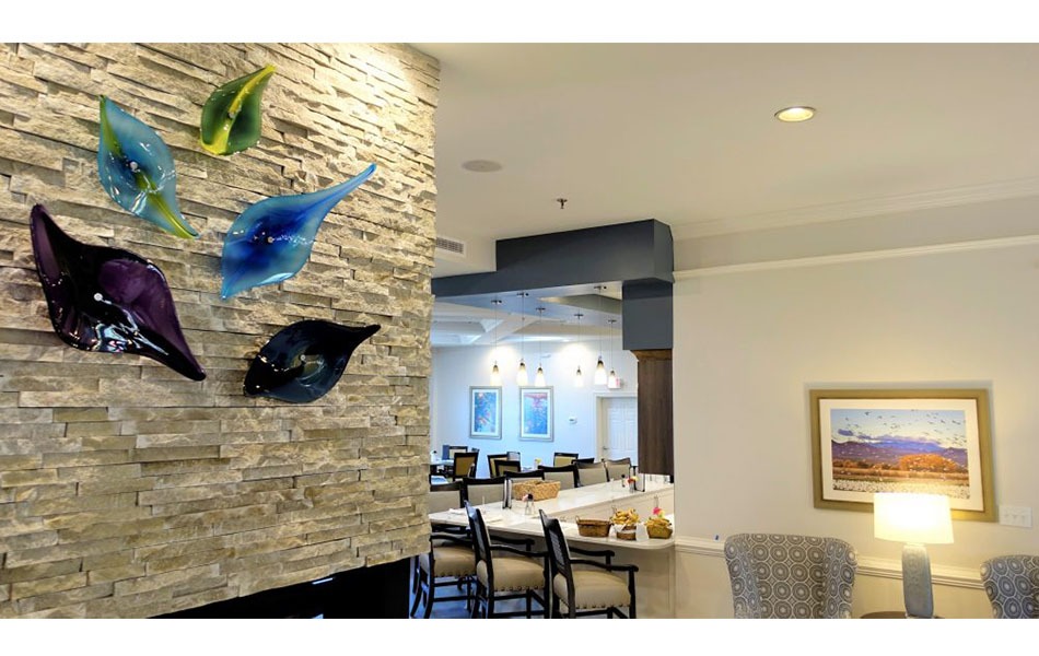 Colorful art sculptures installed on the wall in the healthcare facility