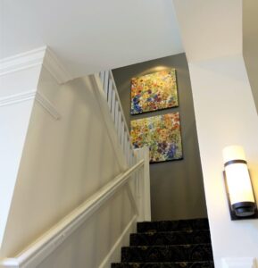 artwork installed on the wall by the stairway