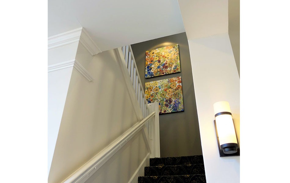 artwork installed on the wall by the stairway
